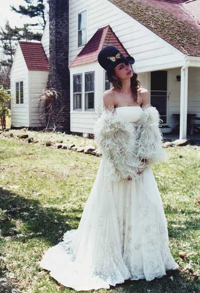  headpiece by Pickle Macaroni is paired with a short wedding dress 